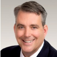 Headshot of Speaker Name